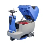 Autolaveuse Autoportée Fiorentini ECOSTAR 48V 90L Une autolaveuse bleue et grise avec des roues. Rendement de 2750 mq/h, autonomie de 5 h, capacité réservoir solution de 90 L, vitesse d'avancement de 0-4 km/h, etc.